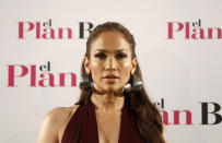 Singer and actress Jennifer Lopez poses during a photocall to promote her movie "The Back-up plan" in Madrid April 27, 2010. REUTERS/Susana Vera (SPAIN - Tags: ENTERTAINMENT)