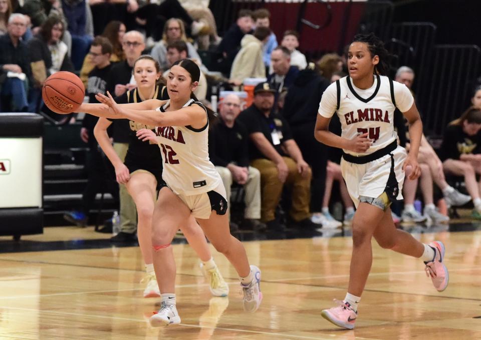 Elmira's Laila Burchard (12) passes the ball ahead during a 51-38 win over Corning in the Section 4 Class AAA girls basketball championship game March 1, 2024 at Elmira High School.