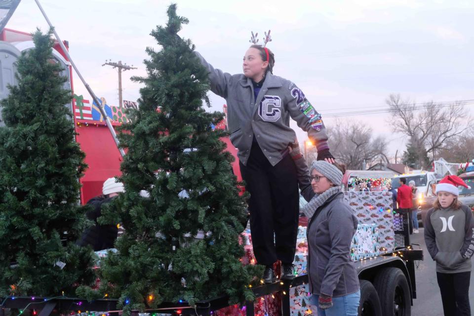 A couple of students from Canyon High School put in the teamwork needed for the school float Friday in Canyon,Texas.
