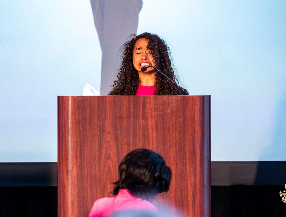 Adrianna Reams, sister of Sade Robinson, speaks about her memories with her sister at the public memorial service Friday at the Baird Center in Milwaukee.