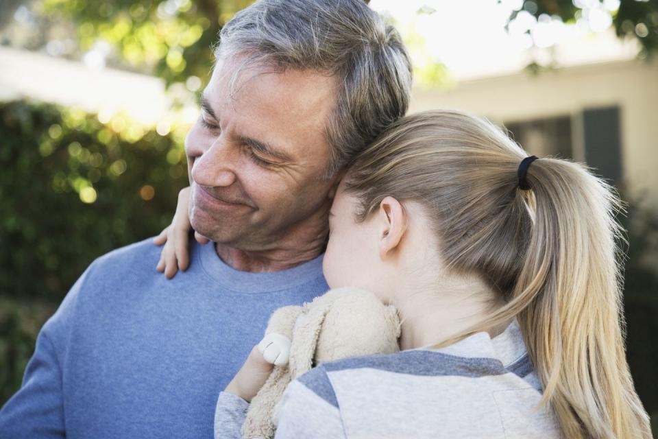 father and daughter hugging