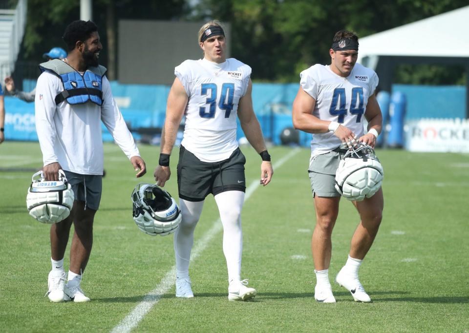 (From left) Lions linebackers <a class="link " href="https://sports.yahoo.com/nfl/players/30237" data-i13n="sec:content-canvas;subsec:anchor_text;elm:context_link" data-ylk="slk:Jalen Reeves-Maybin;sec:content-canvas;subsec:anchor_text;elm:context_link;itc:0">Jalen Reeves-Maybin</a>, <a class="link " href="https://sports.yahoo.com/nfl/players/30189" data-i13n="sec:content-canvas;subsec:anchor_text;elm:context_link" data-ylk="slk:Alex Anzalone;sec:content-canvas;subsec:anchor_text;elm:context_link;itc:0">Alex Anzalone</a> and <a class="link " href="https://sports.yahoo.com/nfl/players/34144" data-i13n="sec:content-canvas;subsec:anchor_text;elm:context_link" data-ylk="slk:Malcolm Rodriguez;sec:content-canvas;subsec:anchor_text;elm:context_link;itc:0">Malcolm Rodriguez</a> walk off the field after training camp on Wednesday, July 26, 2023, in Allen Park.