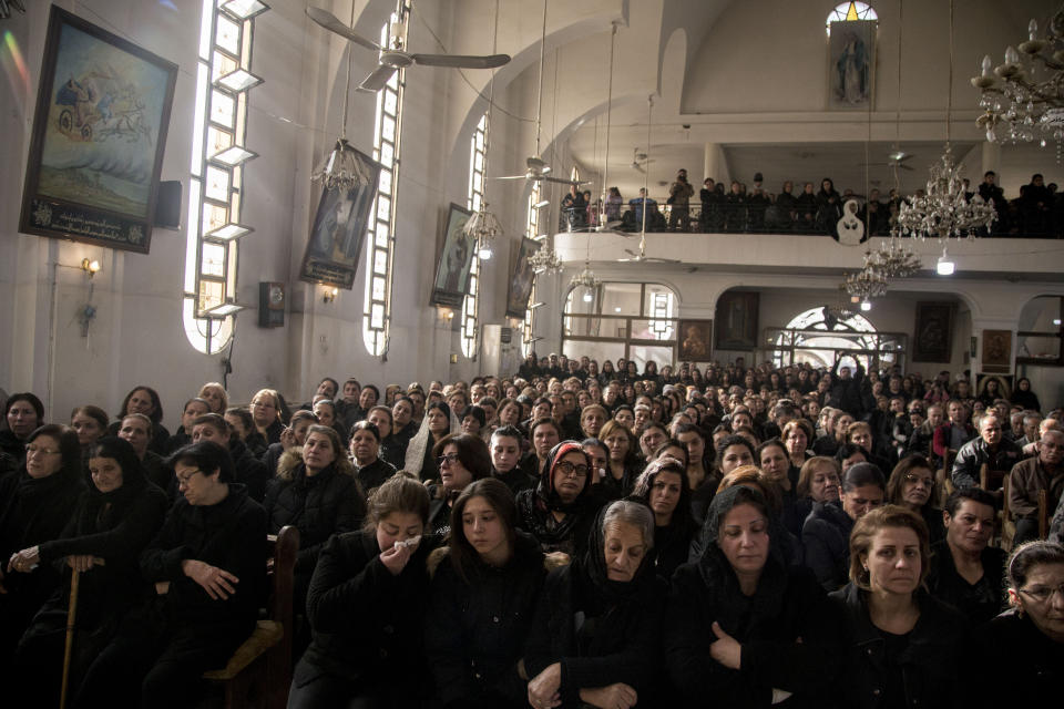People attend the funeral of Said Abdel Ahad, a Christian fighter of the Syriac Military Council, in Hassakeh, Syria, Friday, Nov. 22, 2019. Ahad was killed in Turkish offensive near Tal Tamr. (AP Photo/Baderkhan Ahmad)
