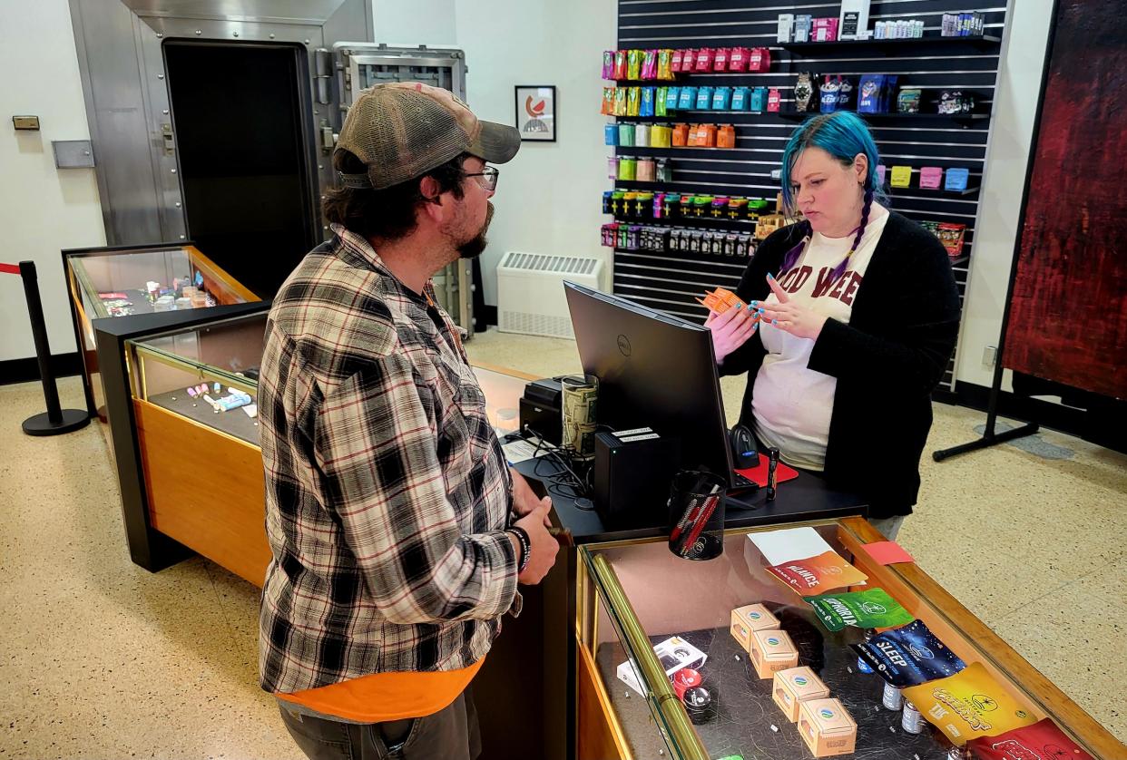 Budtender Victoria Lyons rings up Jeremy Chalut, of Port Sanilac, on Friday, April 26, 2024, at Moses Roses, 1600 Pine Grove Ave., in Port Huron.