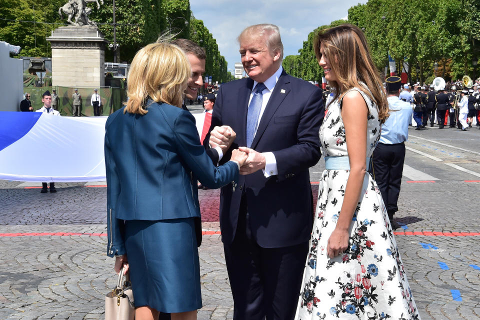 <p>President Donald Trump (2nd R) shakes hands with French President Emmanuel Macron (2ndL) and his wife Brigitte Macron (L), next to US First Lady Melania Trump, during the traditional Bastille Day military parade on the Champs-Elysees avenue in Paris, France, July 14, 2017. (Photo: Christophe Archambault/Pool/Reuters) </p>