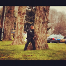 Police and SWAT team members approach a Newtown church with weapons drawn after unspecifi @ St. Rose of Lima. (Dylan Stableford/Yahoo! News)