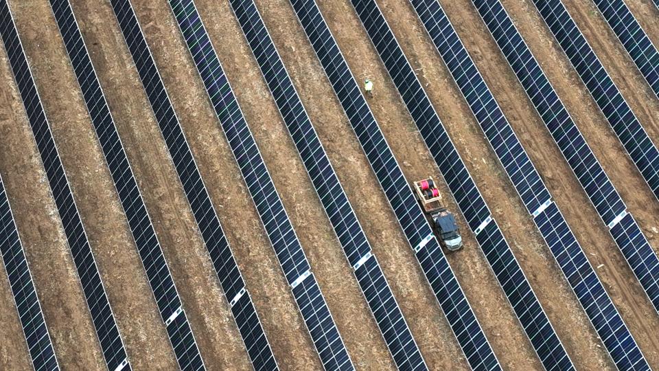 A worker tends to the arrays at the new city-owned solar facility, 5600 Parsons Ave on the Far South Side, on Tuesday, Jan. 2, 2023.
