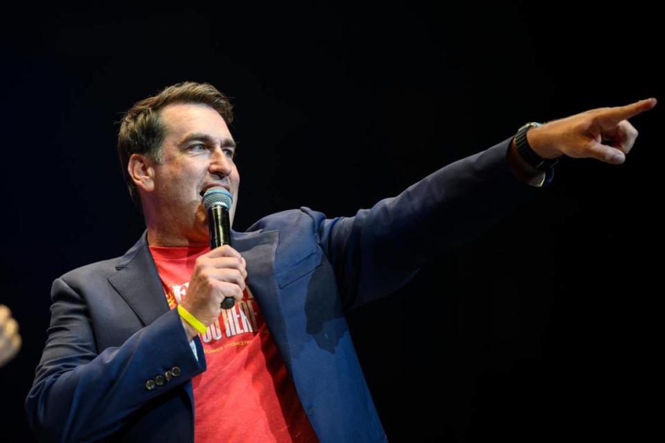 Big Slick host Rob Riggle helped point out bidders vying for a trip to a KU basketball game with him at the Big Slick auction in June.