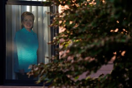 A photo of Democratic presidential candidate Hillary Clinton is seen on a window in the Carroll Gardens neighborhood of Brooklyn, New York, U.S., September 23, 2016. Picture taken September 23, 2016. REUTERS/Brendan McDermid