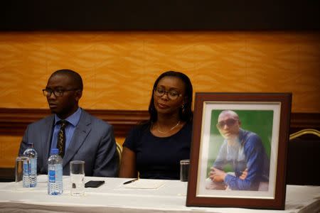 Tom Kabau and Esther Kabau-Wanyoike the brother and sister of Kenyan George Kabau who died in the Ethiopian Airlines crash sit next to his picture during a news conference where their lawyers announced they plan to file a wrongful-death lawsuit against Boeing, at the Serene hotel in Nairobi, Kenya April 16, 2019. REUTERS/Baz Ratner