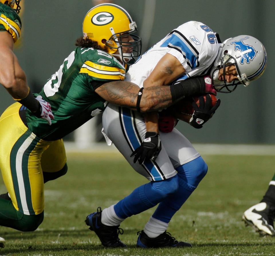 Green Bay Packers linebacker Nick Barnett tackles Detroit Lions Dennis Northcutt after a five yard reception during the fourth quarter of their game Sunday, October 18, 2009 at  Lambeau Field in Green Bay, Wis. The Packers won 26-0.