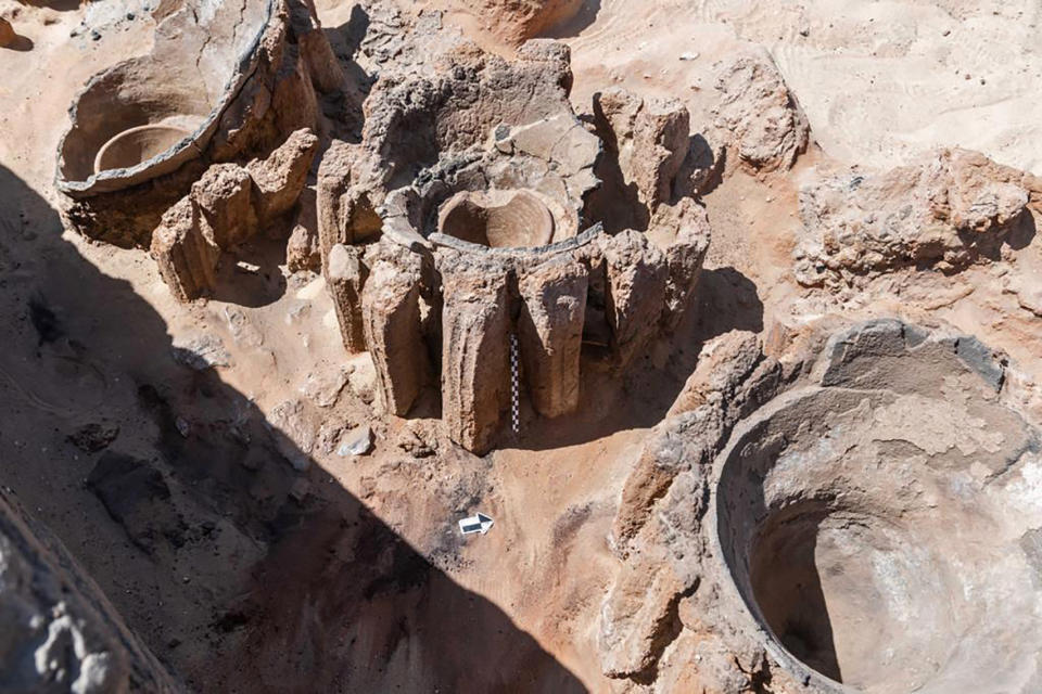 This photo provided by the Egyptian Antiquities Ministry on Saturday, Feb. 13, 2021 shows pottery basins, which archaeologists say had been used to heat up a mixture of grains and water to produce beer, in Abydos, some 450 km (280 miles) south of Cairo, Egypt. The basins were part of what could be the oldest known beer factory unearthed in Abydos, an ancient burial ground dating back to the region of King Narmer, the last king of the Predynastic Period (6000 - 3150 B.C.), according to Mostafa Waziri, secretary general of the Supreme Council of Antiquities. (Egyptian Antiquities Ministry via AP)