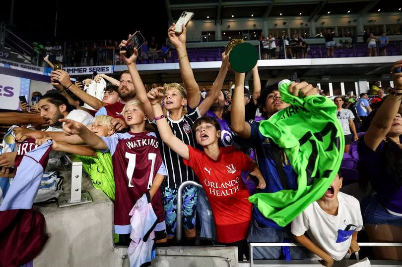 Fans cheer during a game between Aston Villa and Fulham at Exploria Stadium on July 26, 2023 in Orlando, Florida.