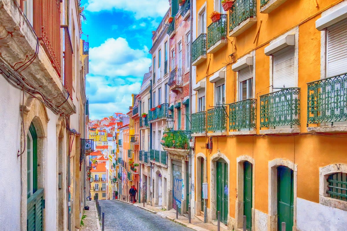 Romantic restaurants and pastel de nata cafes line Lisbon’s pastel streets (Getty Images/iStockphoto)