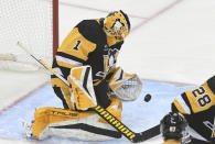 Pittsburgh Penguins goalie Casey DeSmith (1) stops a shot by the Toronto Maple Leafs during the first period of an NHL hockey game, Saturday, Nov. 26, 2022, in Pittsburgh. (AP Photo/Philip G. Pavely)