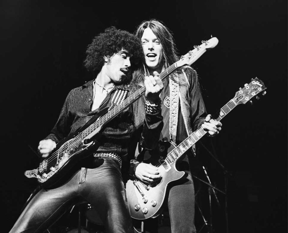 Phil Lynott and Scott Gorham onstage