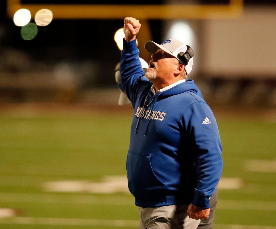 Olton head coach Ross Lassiter talks to his players against Farwell in a Class 2A Bi-District football game, Thursday, Nov. 10, 2022, at Wildcat Stadium in Littlefield.