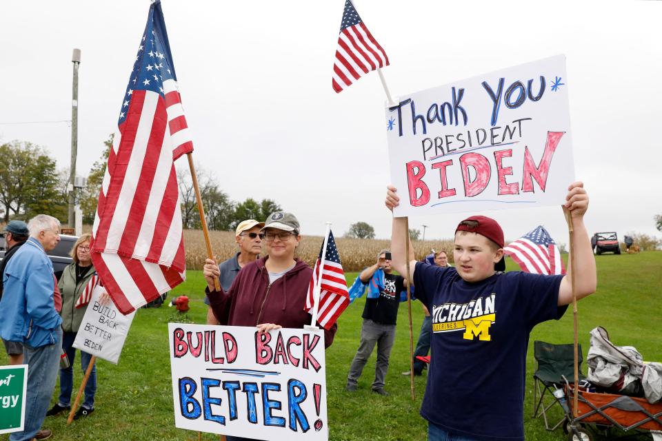 Biden supporters bearing banners that say 