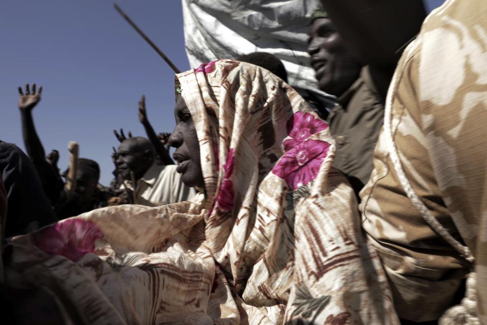 FILE - In this Jan. 9, 2020 file photo, people chant slogans during a visit organized by The World Food Program (WFP) in the conflict-affected remote town of Kauda, Nuba Mountains, Sudan. The World Food Program won the Nobel Peace Prize on Friday, Oct. 9 for its efforts to combat hunger amid the coronavirus pandemic, recognition that shines light on vulnerable communities across the Middle East and Africa that the U.N. agency seeks to help, those starving and living in war zones that may rarely get the world’s attention.(AP Photo/Nariman El-Mofty, File)