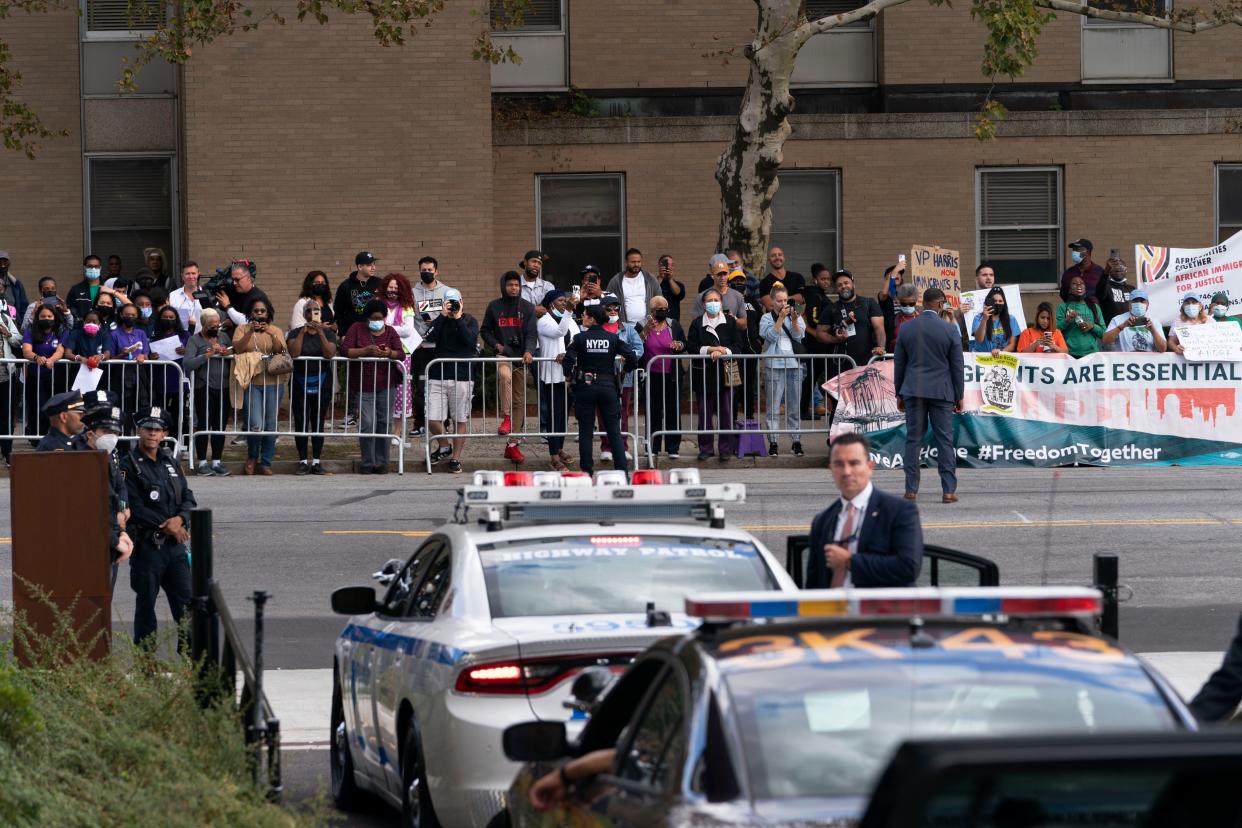 People wait to see Vice President Kamala Harris leave after speaking at the Northeast Bronx YMCA, in the Bronx borough of New York, Friday, Oct. 22. 