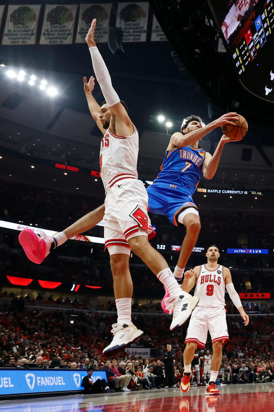 Oct 25, 2023; Chicago, Illinois, USA; Oklahoma City Thunder forward Chet Holmgren (7) goes to the basket against Chicago Bulls guard Zach LaVine (8) during the first half of a basketball game at United Center. Mandatory Credit: Kamil Krzaczynski-USA TODAY Sports