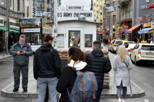 Tourists have flocked to Checkpoint Charlie since the reunification of Germany