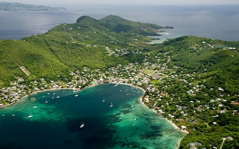 An aerial view of Bequia, with St.Vincent visible in the background - Credit: Getty Images