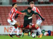 Dele Alli, centre, takes on Jordan Cousins, left, and Nathan Collins