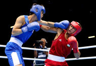 LONDON, ENGLAND - AUGUST 06: Han Soonchul of Korea (L) in action with Fazliddin Gaibnazarov of Uzbekistan during the Men's Light (60kg) Boxing on Day 10 of the London 2012 Olympic Games at ExCeL on August 6, 2012 in London, England. (Photo by Scott Heavey/Getty Images)