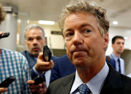FILE PHOTO: Senator Rand Paul (R-KY) speaks to reporters after Senate Republicans unveiled their version of legislation that would replace Obamacare on Capitol Hill in Washington, U.S., June 22, 2017. REUTERS/Joshua Roberts/File Photo