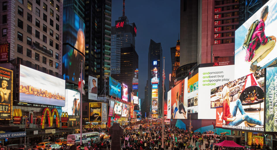 A crowd at Times Square at night