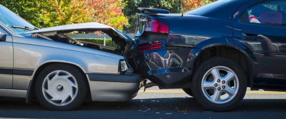 Auto accident involving two cars on a city street