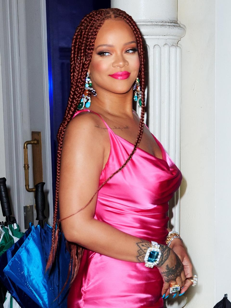 Rihanna wears a hot pink dress when arriving at a Fenty event on June 18, 2019 in New York City