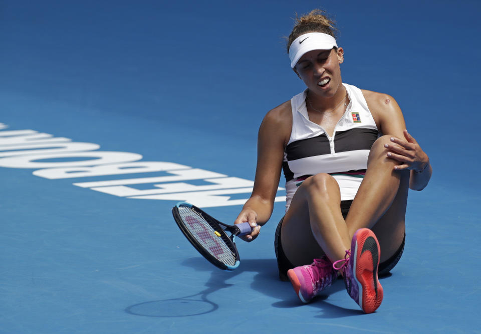 United States' Madison Keys reacts after falling during her first round match against Australia's Destanee Aiava at the Australian Open tennis championships in Melbourne, Australia, Tuesday, Jan. 15, 2019. (AP Photo/Kin Cheung)