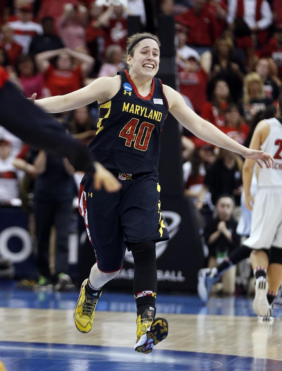 Maryland guard Katie Rutan (40) reacts as times expires in a regional final against Louisville in the NCAA women's college basketball tournament Tuesday, April 1, 2014, in Louisville, Ky. Maryland won 76-73. (AP Photo/John Bazemore)