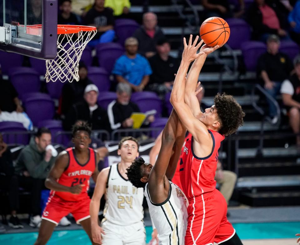 Columbus Explorers guard Cameron boozer (12) shoots the ball during the first half of the City of Palms Classic semifinal game against the Paul VI Panthers at Suncoast Arena in Ft. Myers on Tuesday, Dec. 20, 2022. 