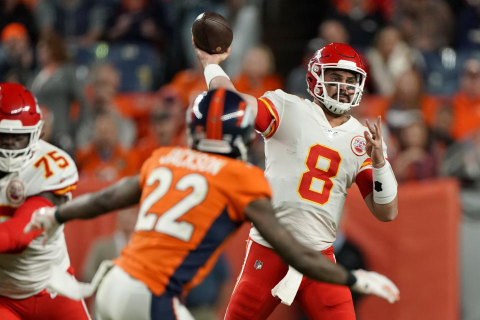 Kansas City Chiefs quarterback Matt Moore (8) throws as Denver Broncos defensive back Kareem Jackson (22) pursues during the second half of an NFL football game, Thursday, Oct. 17, 2019, in Denver. (AP Photo/Jack Dempsey)