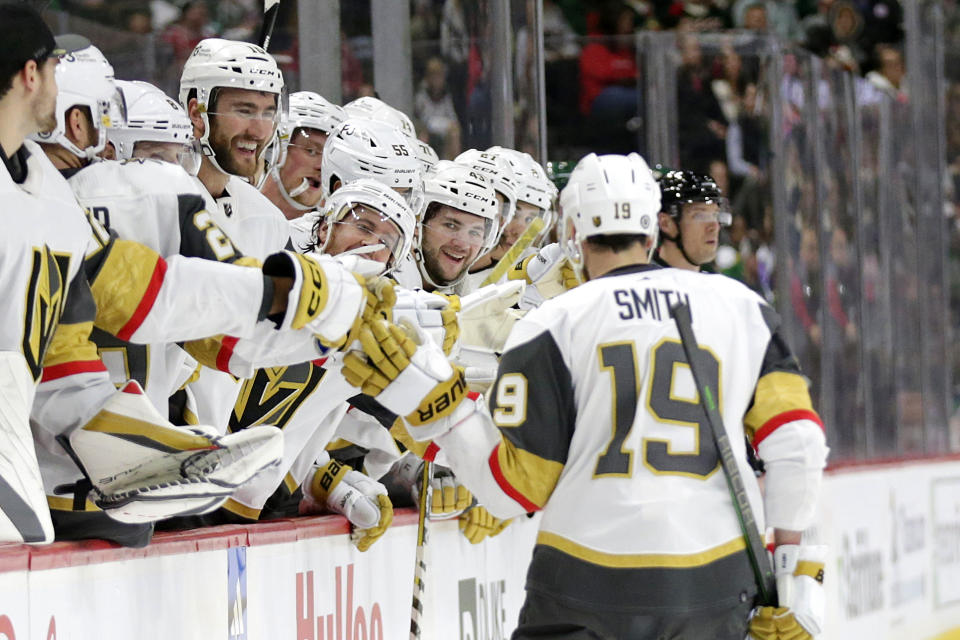 Vegas Golden Knights Reilly Smith (19) is congratulated by teammates after scoring a goal on a penalty shot against the Minnesota Wild in the second period of an NHL hockey game Thursday, Feb. 9, 2023, in St. Paul, Minn. (AP Photo/Andy Clayton-King)