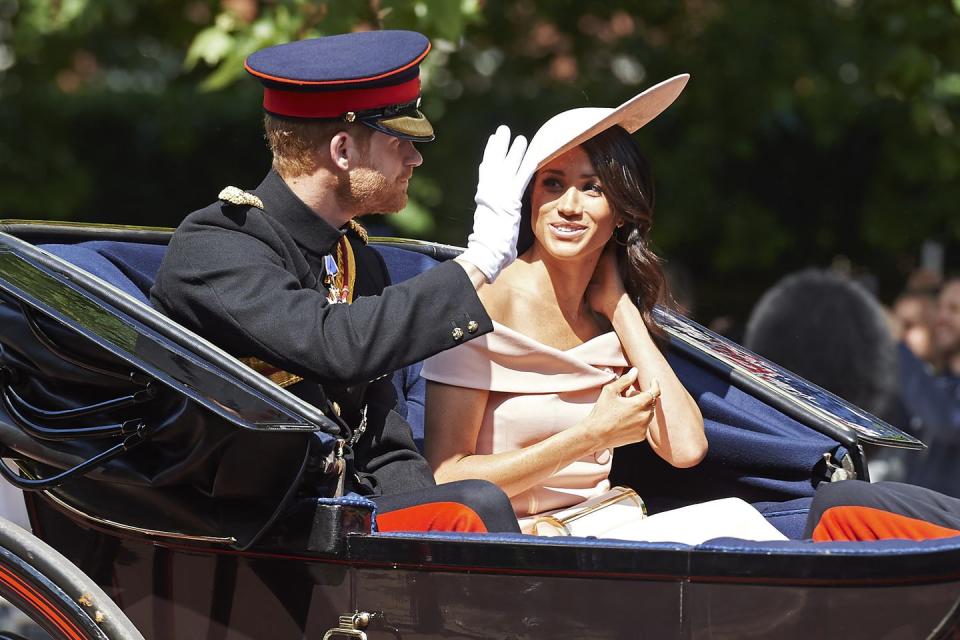 Meghan and Harry travel by carriage to the celebrations.