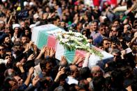 Iranians carry a coffin during a public funeral ceremony on September 24, 2018 for people killed during a weekend attack on a military parade in the southwestern Iranian city of Ahvaz