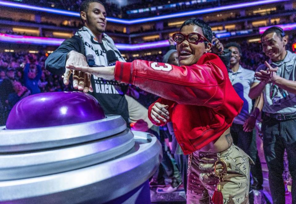 Actor-singer-songwriter Teyana Taylor lights the beam for the Sacramento Kings with forward Keegan Murray (13) after the team defeated the defending NBA champion Denver Nuggets on Friday, Feb. 9, 2024. Taylor was in Sacramento to film a new movie with Leonardo DiCaprio and Sean Penn.