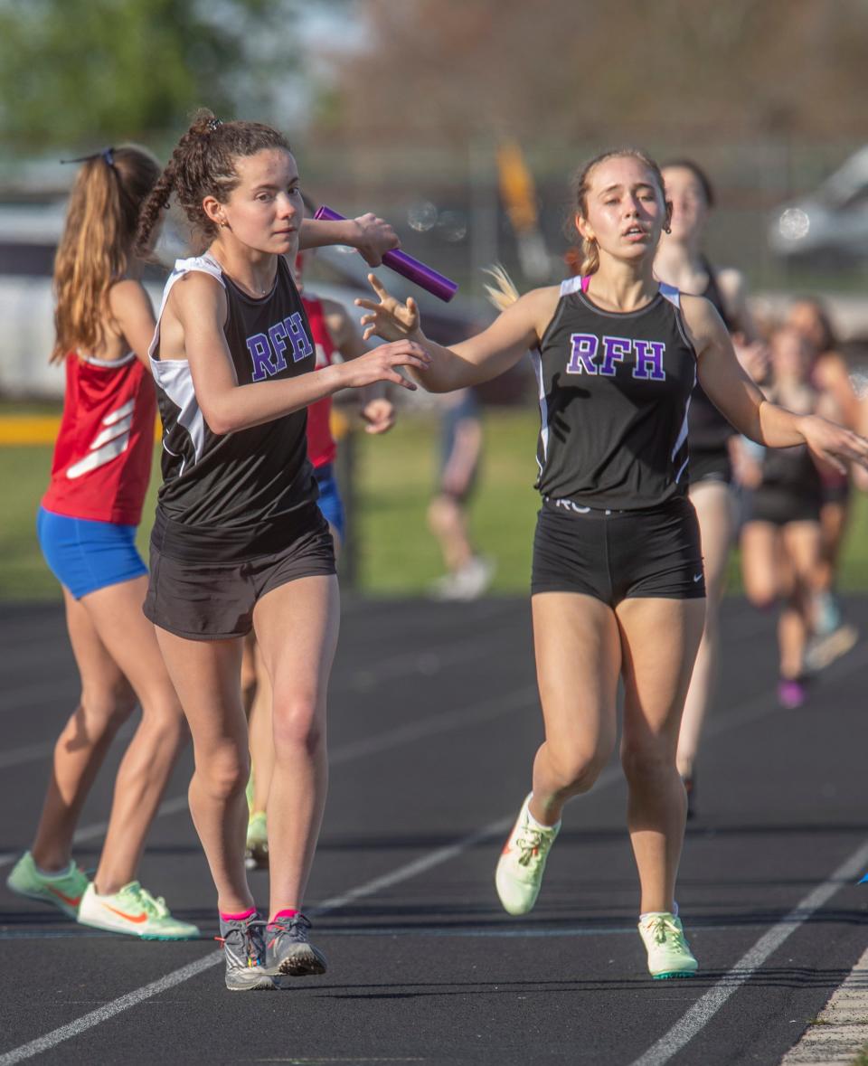 Rumson Sarah Butler takes handoff from Ryan Malone in their 4X800 relay win. Monmouth County Track Relays at Howell High School in Howell on May 5, 2022.