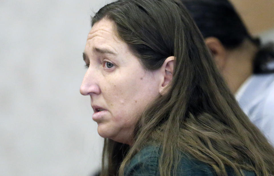 Megan Huntsman, accused of killing six of her babies and storing their bodies in her garage, appears in court Monday, April 21, 2014, in Provo, Utah. A state judge granted county prosecutors a week to sort through evidence and ensure they choose the proper charges. Huntsman is being held on $6 million bail. (AP Photo/Rick Bowmer, Pool)