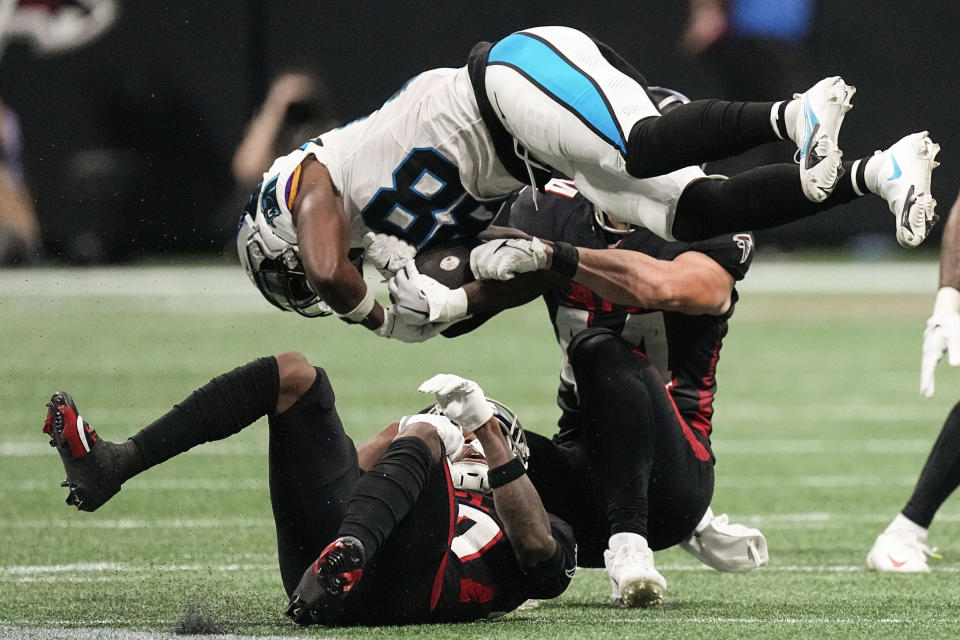Carolina Panthers wide receiver Terrace Marshall Jr. (88) is stopped by Atlanta Falcons linebacker Troy Andersen (44) during the first half of an NFL football game, Sunday, Sept. 10, 2023, in Atlanta. (AP Photo/John Bazemore)