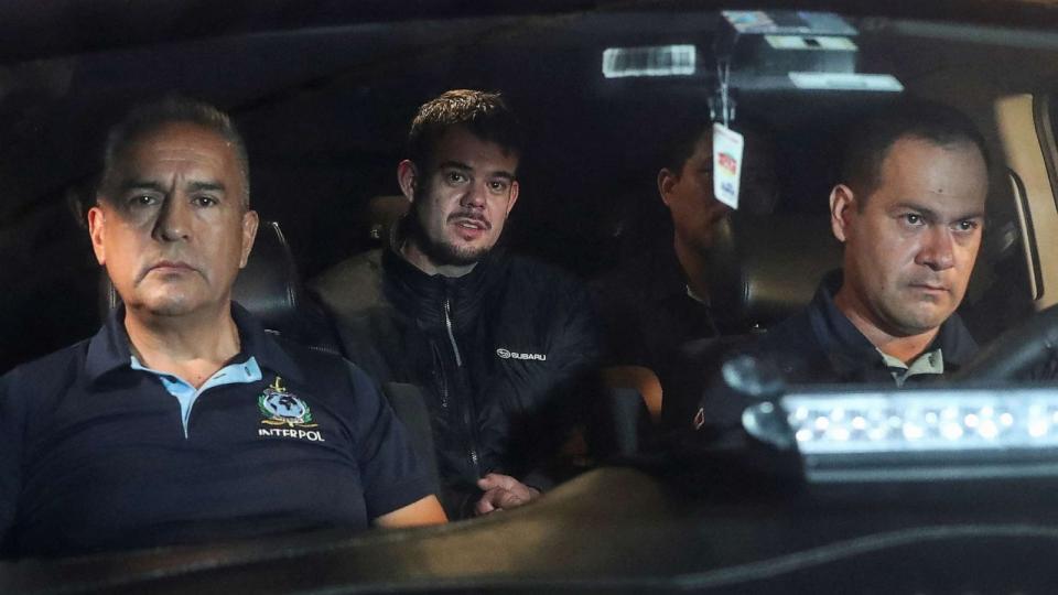 PHOTO: Dutch citizen Joran van der Sloot, who was serving a 28-year sentence in Peru, is escorted to the airport to be extradited to the U.S., to face charges of extortion and wire fraud against the family of Natalee Holloway, June 8, 2023. (Sebastian Castaneda/Reuters)