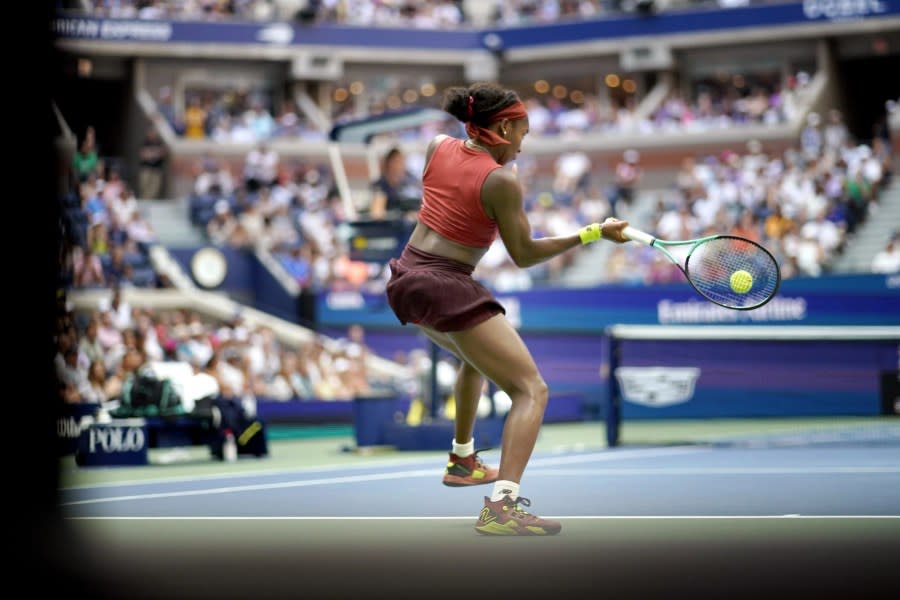 Coco Gauff, of the United States, returns to Caroline Wozniacki, of Denmark, during the fourth round of the U.S. Open tennis championships, Sunday, Sept. 3, 2023, in New York. (AP Photo/Eduardo Munoz Alvarez)