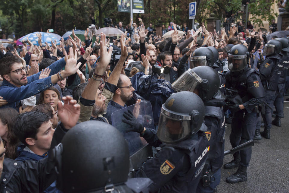 Violence erupts as Catalans vote on referendum on a split from Spain