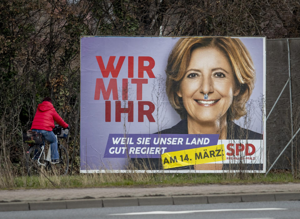 An election poster shows social democratic prime minister and top candidate for the Rhineland-Palatinate federal state elections Malu Dreyer in Frankenthal, Germany, Wednesday, March 10, 2021. The elections will take place next Sunday. (AP Photo/Michael Probst)