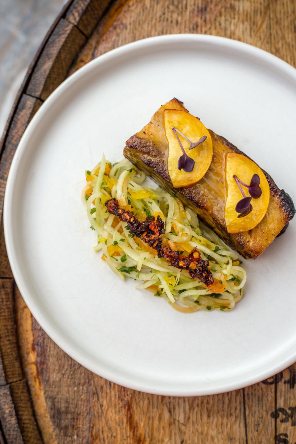 The Pork Belly at 610 Magnolia restaurant in Louisville features peach, apricot, kohlrabi, dill, and chili crunch.