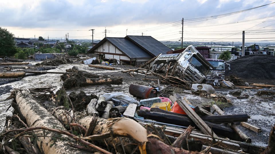 Debris from flooding sits in the road in the city of Kurume, Fukuoka prefecture, on July 10, 2023. - Kazuhiro Nogi/AFP/Getty Images